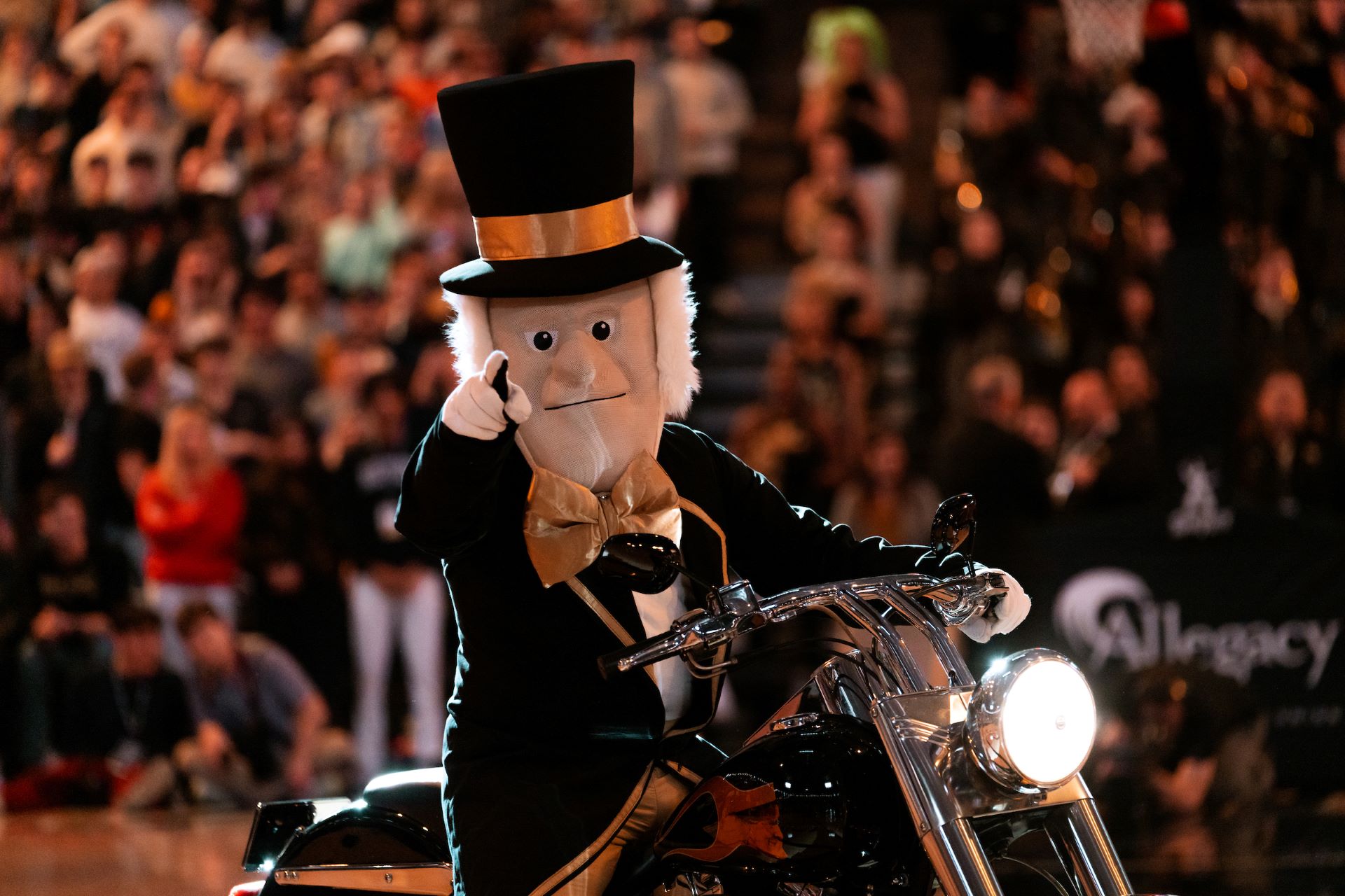 Demon Deacon and his motorcycle at a basketball game