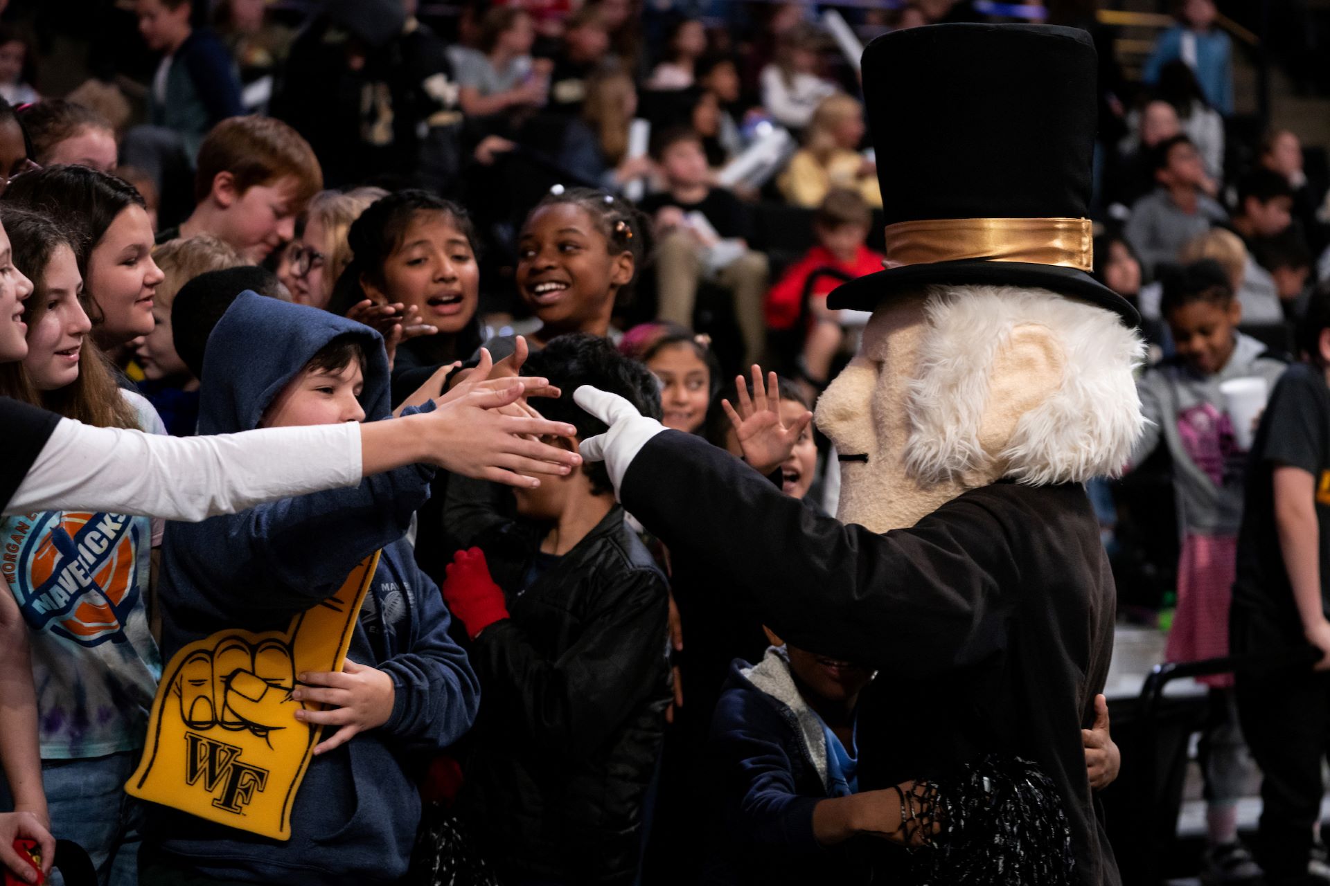 Demon Deacon interacting with fans